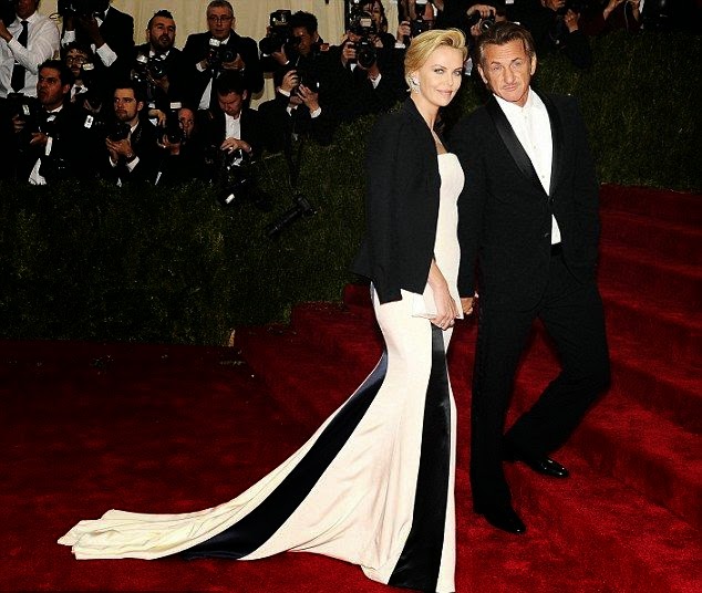 Charlize Theron shows off her easy way of love on June 2014 Issue of Vogue She’s definitely look gorgeous and very exclusive in this long classic white dress as Charlize Theron managed the Dior gown with ease on Monday night, April 5, 2014 in New York City.