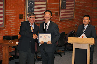 Dr. Webb congratulates students from ZPC