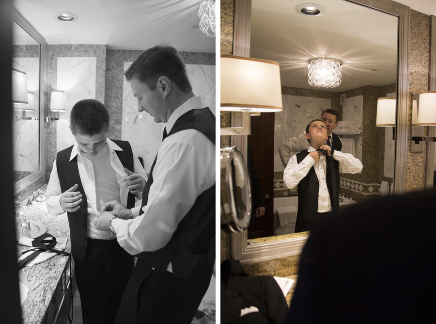 candid groomsmen getting ready in New York Palace hotel bathroom before wedding ceremony