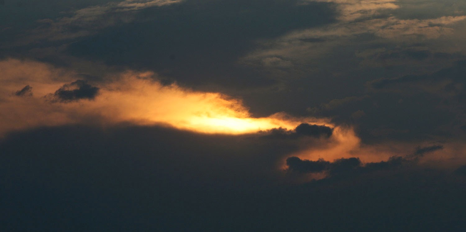 Sun descending through the clouds Sun descending through the clouds