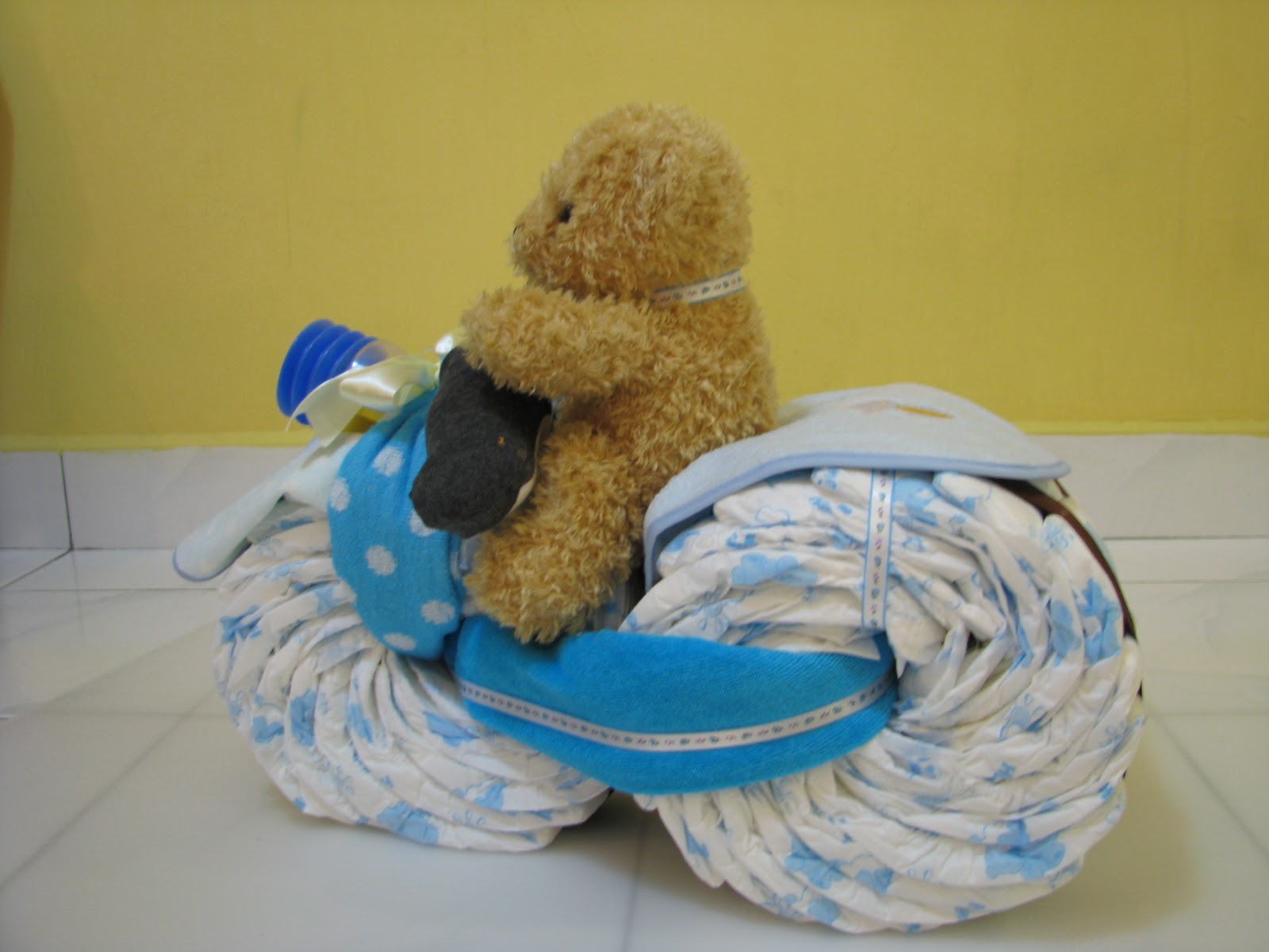 L'abeille Bakes A Tricycle diaper cake for a handsome baby boy!