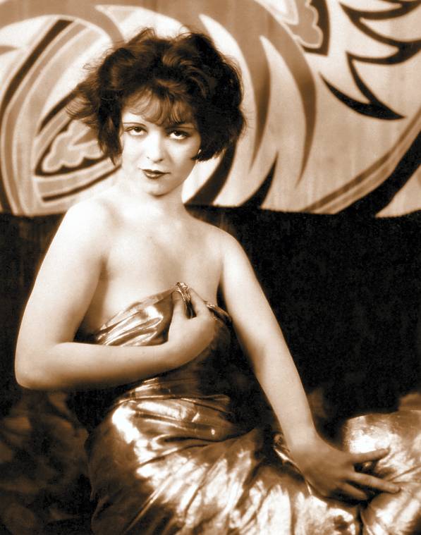 http://4.bp.blogspot.com/--JAf2Km37hk/URa6aHo7mOI/AAAAAAAAX-0/C1NEyYLcuZc/s1600/photo-movie-star-clara-bow-wrapped-in-metallic-sheen-cloth-looking-into-camera-hands-posed.jpg