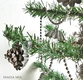 Christmas tree decked out in baking tart tins and chain, by Magia Mia, featured on I Love That Junk