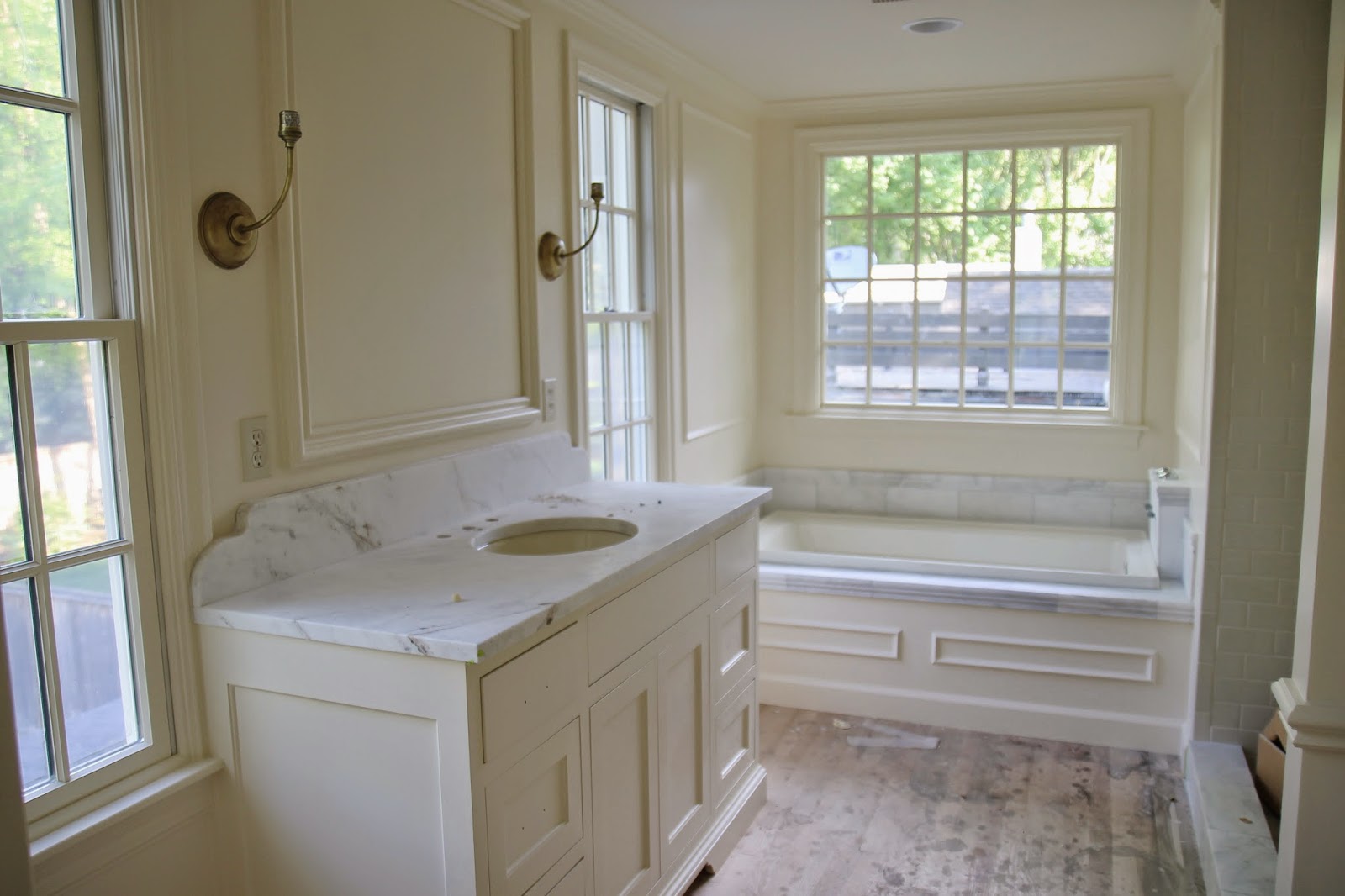 Bronze bathroom lighting Benjamin Moore Navajo White Paint
