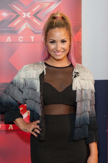 Demi Lovato throws out drug singer