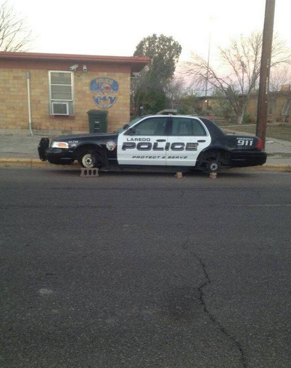 All That Spam A Police Car Up On Blocks With No Wheels