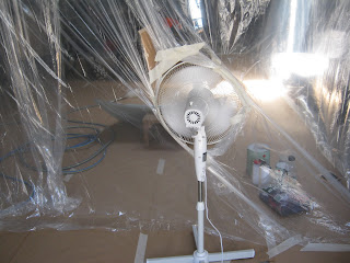 Spray booth made of plastic drop sheets with fan Spray booth made of plastic drop sheets with fan