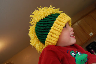 boy wearing a knit mohawk hat