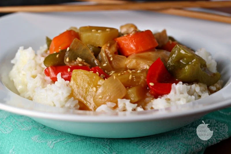Slow Cooker Sweet and Sour Chicken: Tender chicken thighs and veggies in a delightful sweet and sour sauce! 