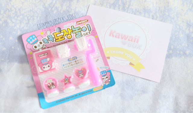 October 2015 Kawaii Box Review + Giveaway Here's a closer look at the 11 cute Japanese stationery, beauty, plush, and canddy items from the October 2015 Kawaii Box, including a Flan pencil pouch, DIY Meiji candy, nail art stickers, decoden stickers, animal stickers, printed envelopes, a lollipop pen, a blue lollipop, a monster pouch, a neko emoji pouch, and more!