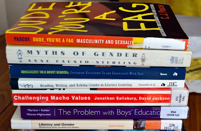 Pile of books on gender and reading