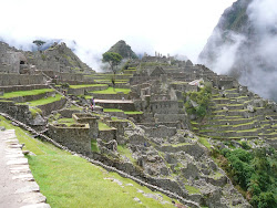Machu Picchu central sector with temples, unrestored areas, watercourse, stairs