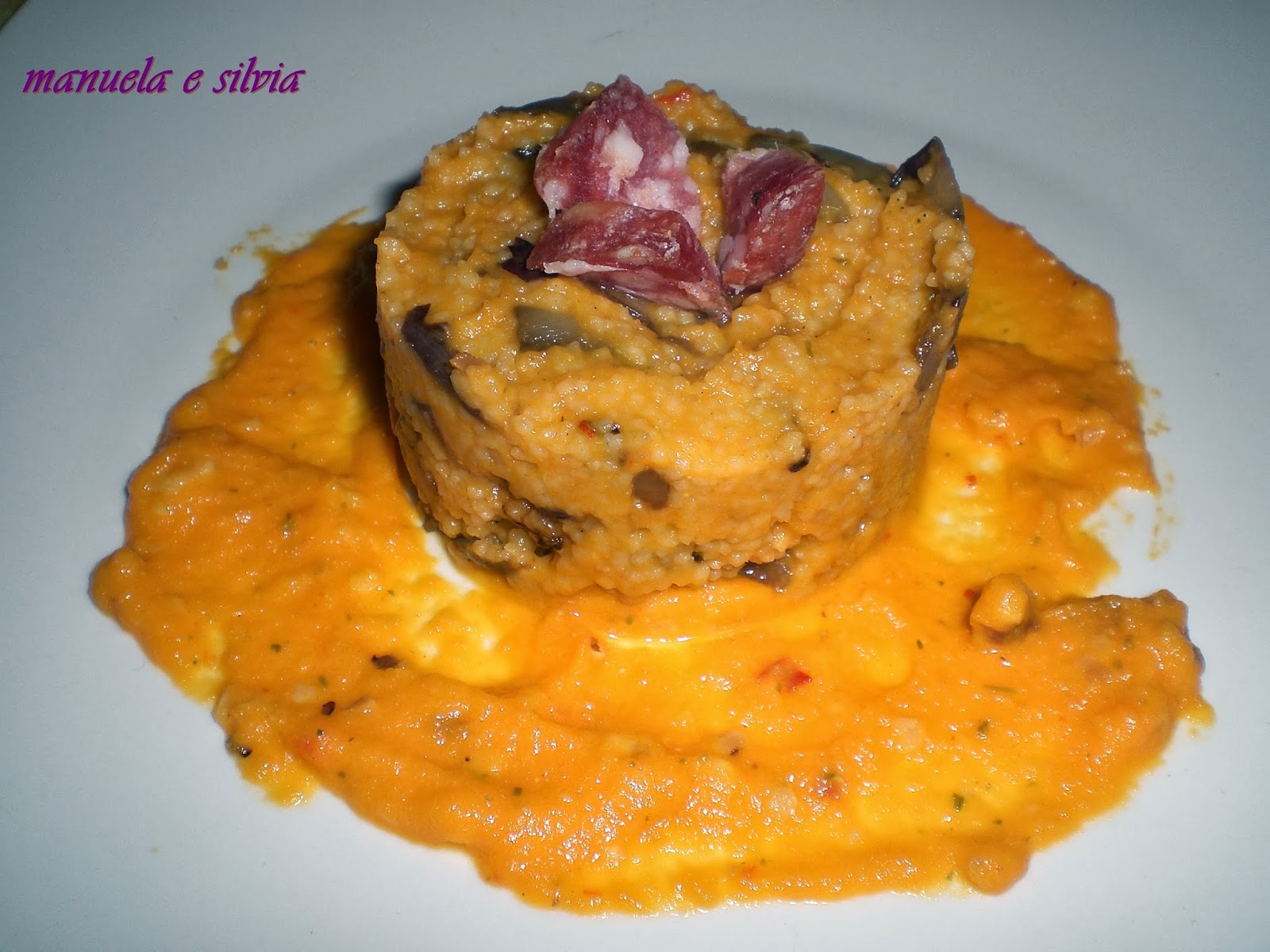 cous cous con crema aromatica di carote, radicchio croccante e cubetti di salame