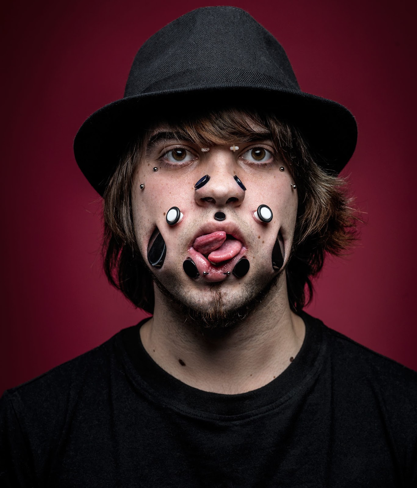 Exquisite Sapphire Flesh Tunnels on face.A new trend?