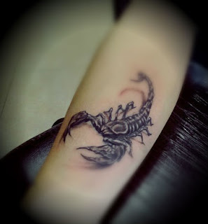 scorpion tattoo on the leg