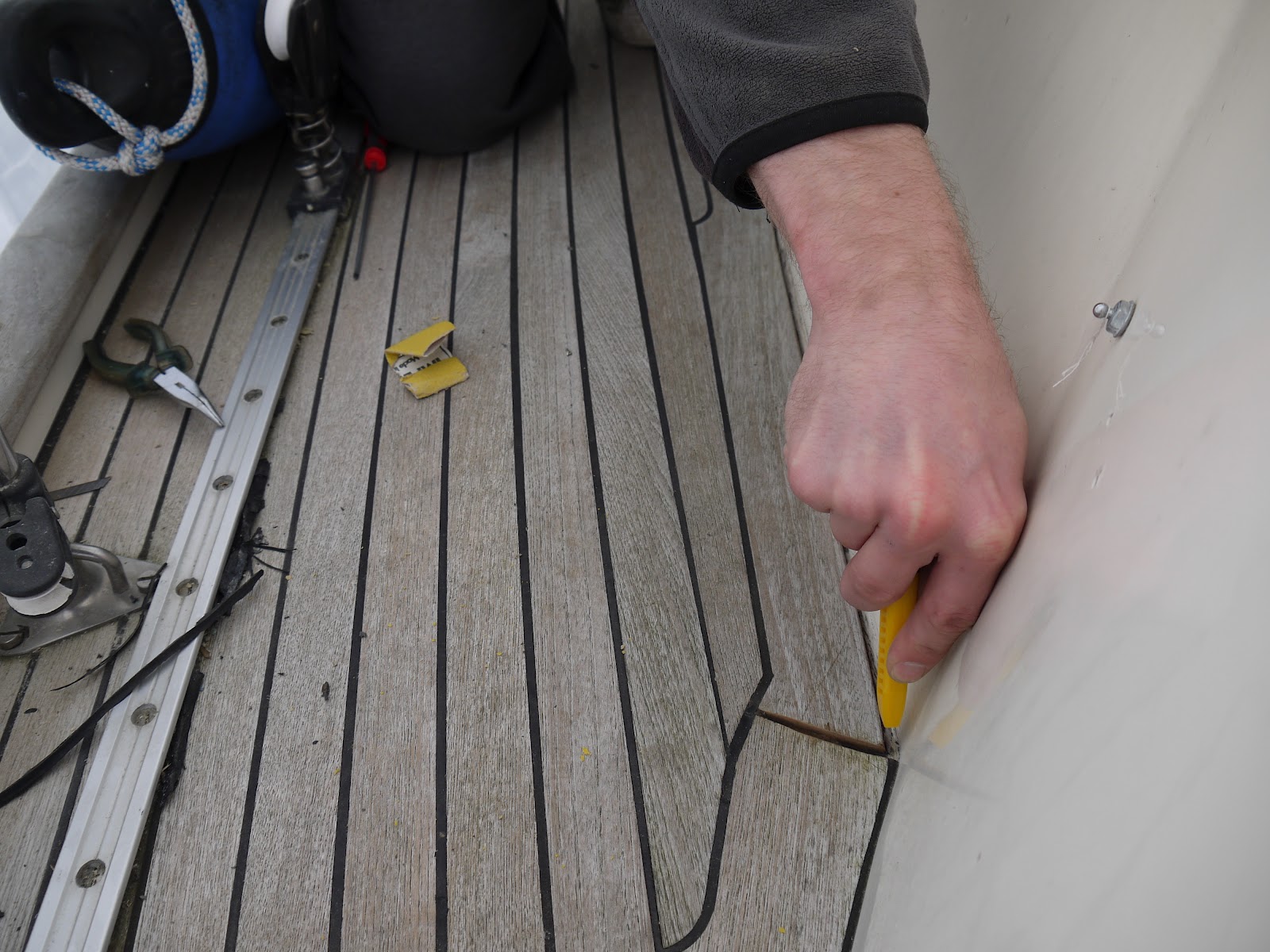 Teak deck maintenance injecting epoxy and recaulking S/Y Dolphin Dance