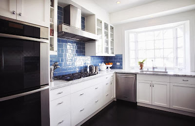 modern kitchen by richens design modern kitchen by richens design in white and blue tiles as backdrop