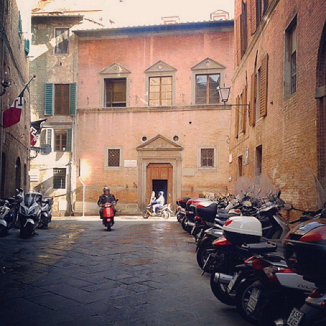 Vespa parking in the Civetta (owl) neighborhood near piazza del Campo Vespa parking in the Civetta (owl) neighborhood near piazza del Campo