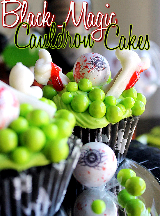 Black Magic Cauldron Cupcakes with Lime Green Sixlets, Gumball Eyebals, and chocolate Pretzel 'Bones.' #SweetworksFall #ad