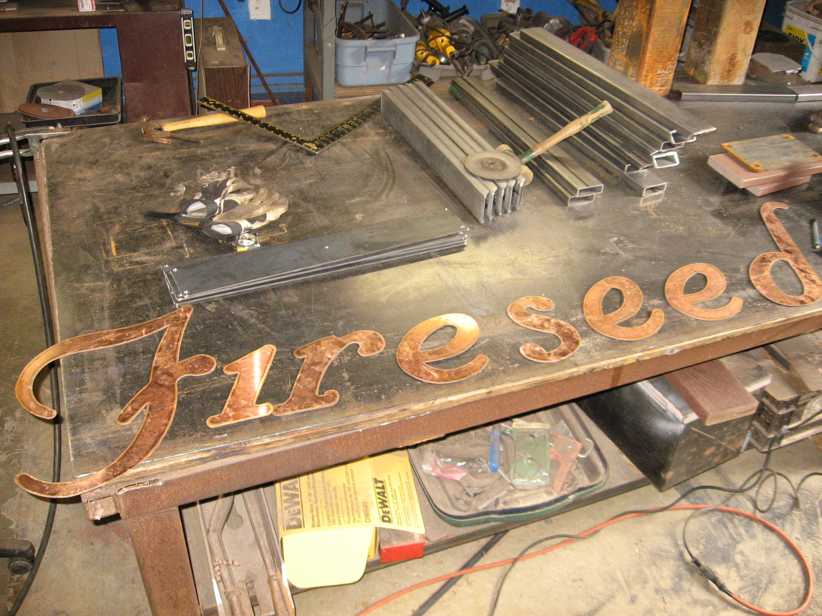 heavy metal works metal entry sign fire seed catering and event wright metal works