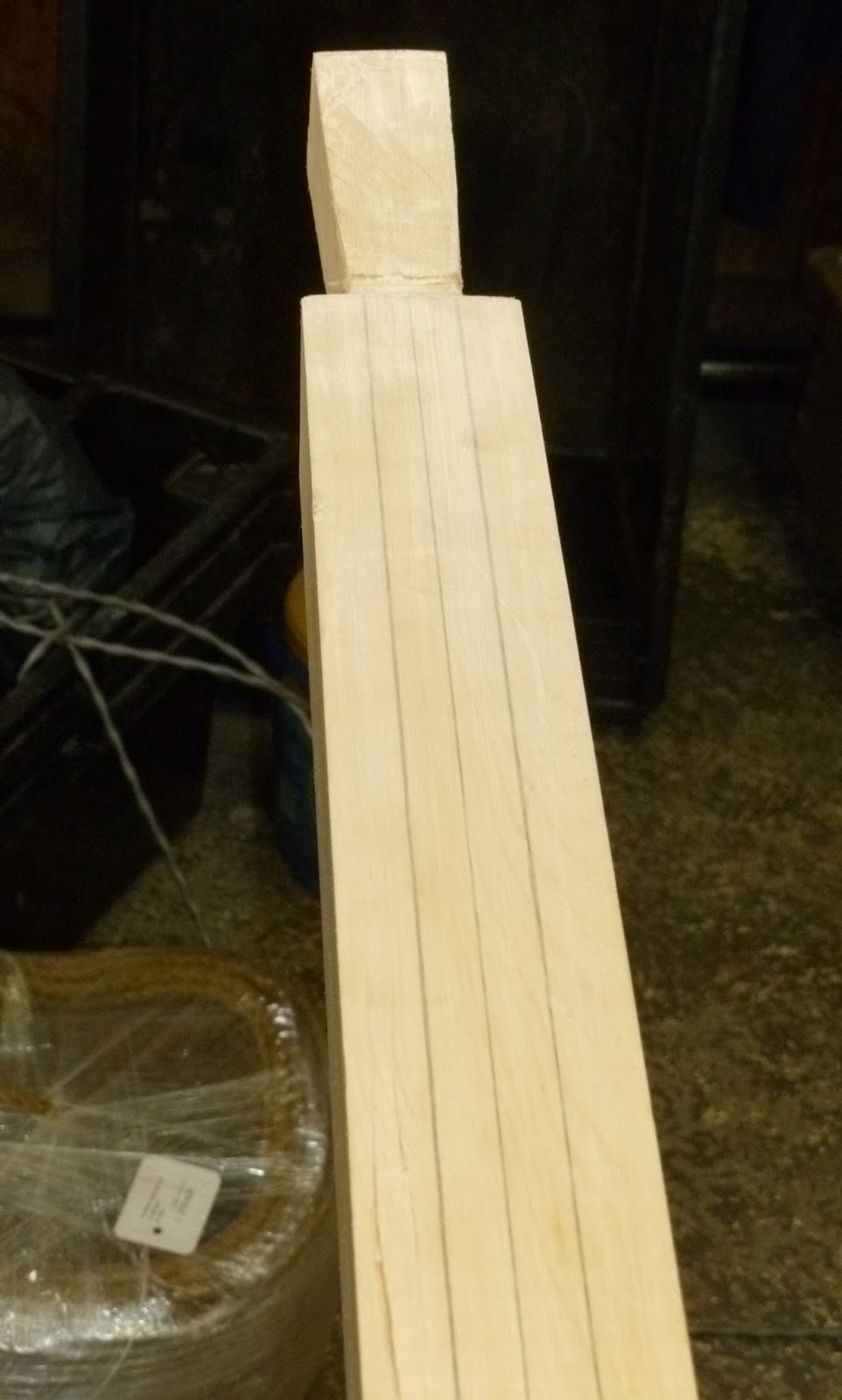 ... making the oar round. This wood for this oar is yellow cedar
