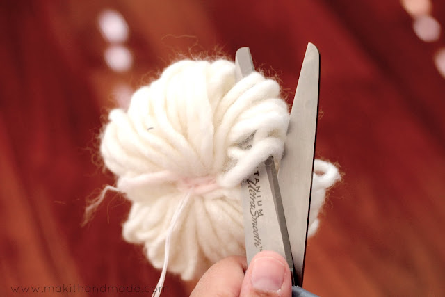 The Perfect Pom Pom Tutorial By Make It Handmade. Learn the secret to making perfect, round, fluffy pom poms and how to secure them so they'll never come off.