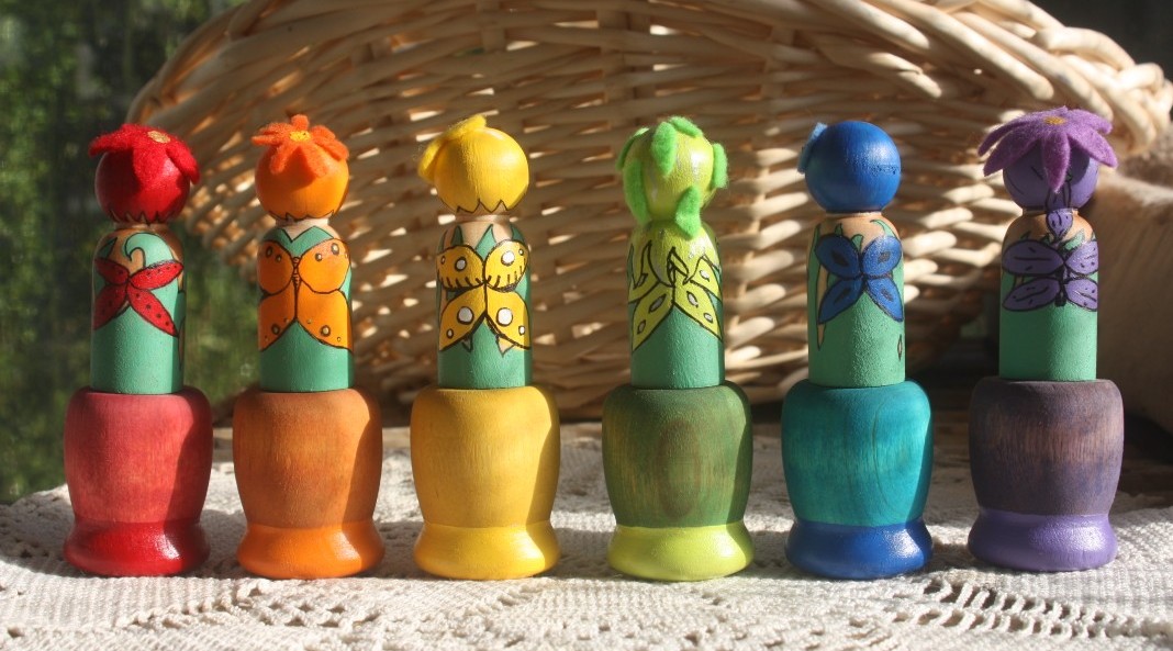 wooden peg dolls in cups