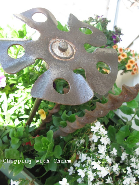 Chipping with Charm: Paint Stirrer Junk Flower...http://chippingwithcharm.blogspot.com/