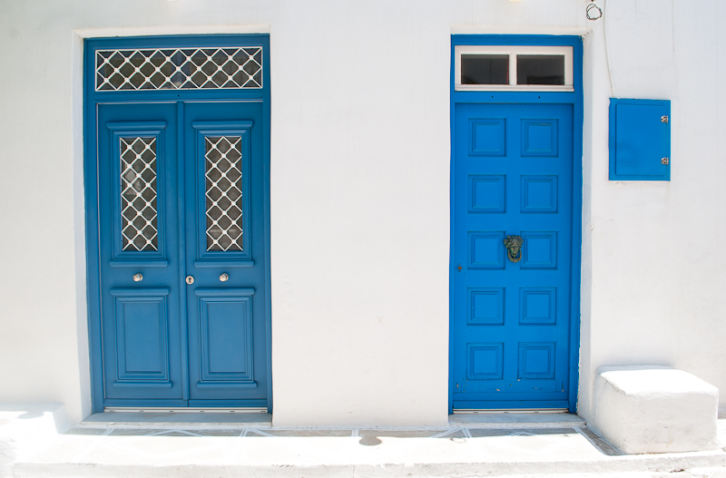 white walls and blue doors in mykonos town house with white walls and blue doors in greece mykonos