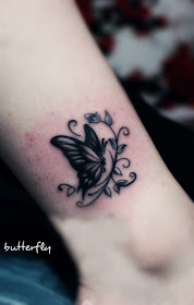 black butterfly tattoo on the ankle
