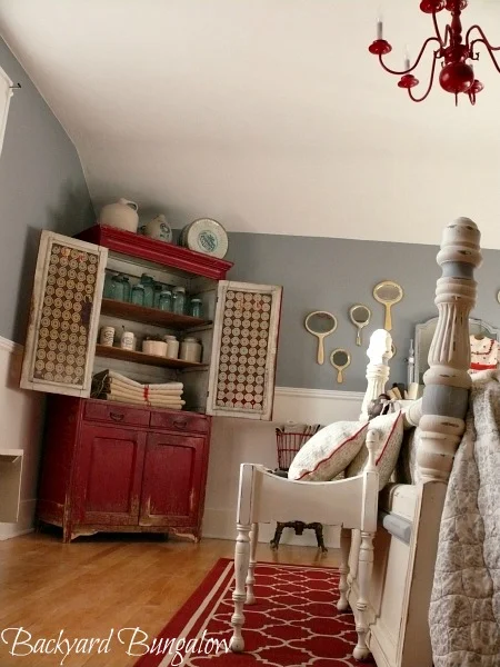 red armoire in bedroom