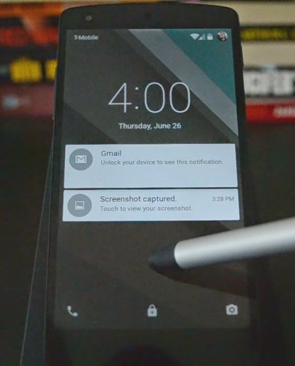 Nexus 5, running Android L, showing the new lock screen/notification cards