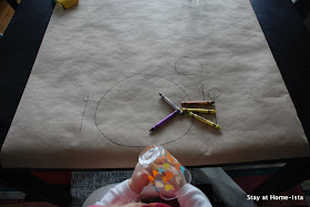Using craft paper to create a tablecloth for a dinner with kids