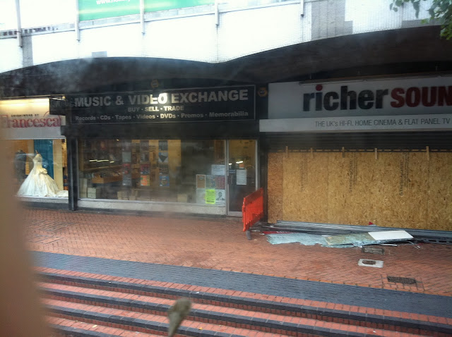 a storefront with boarded up windows