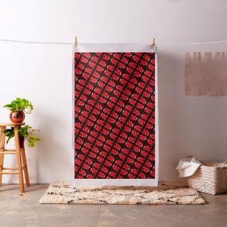 Susan Golis http://www.zazzle.com/modern_red_rose_with_black_flower_fabric-256084887526996986?rf=238418686999709759