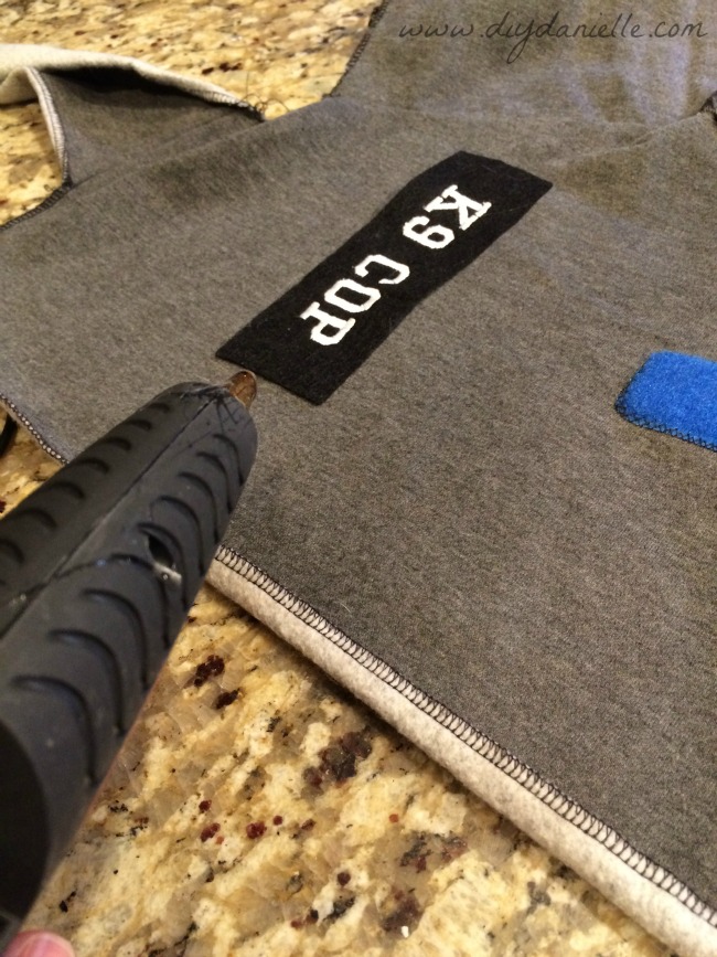 Create a patch for your vest and glue it on. Create a patch for your vest and glue it on.