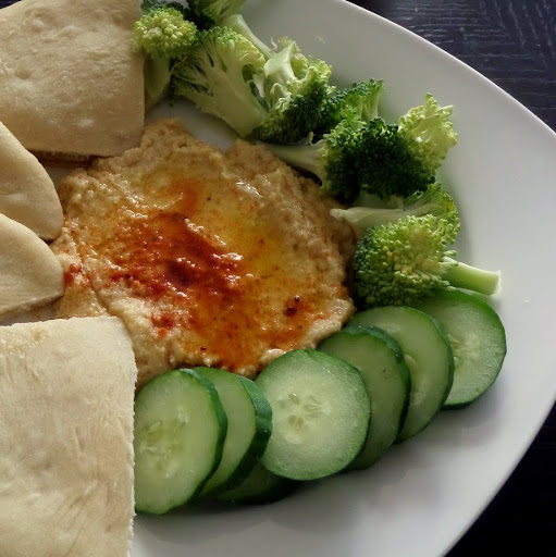 Hummus:  A creamy dip or spread made from chickpeas, tahini, lemon juice and olive oil.  Great with vegetables or pita.
