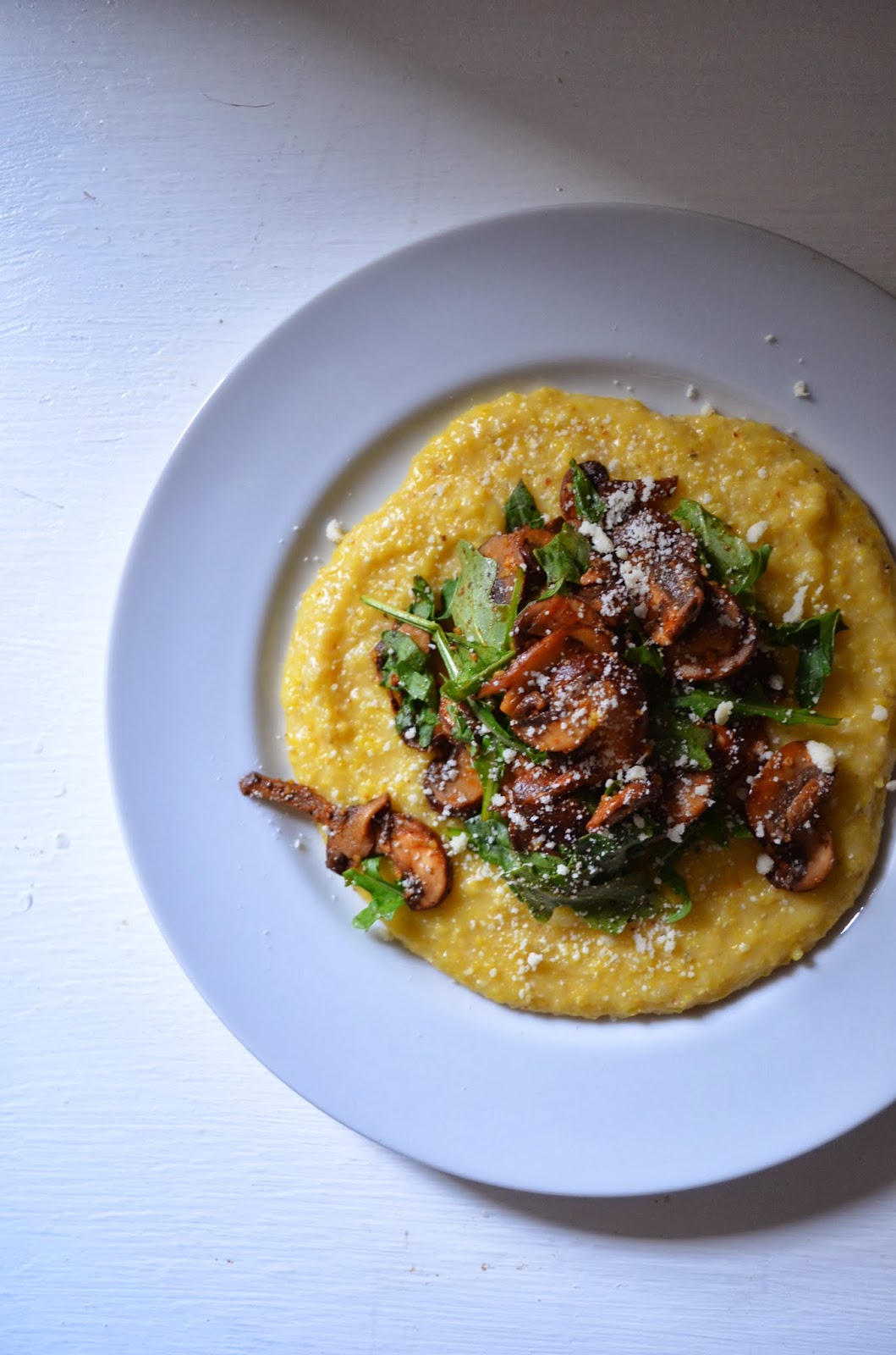 amour fou(d) soft polenta with mushrooms and arugula.