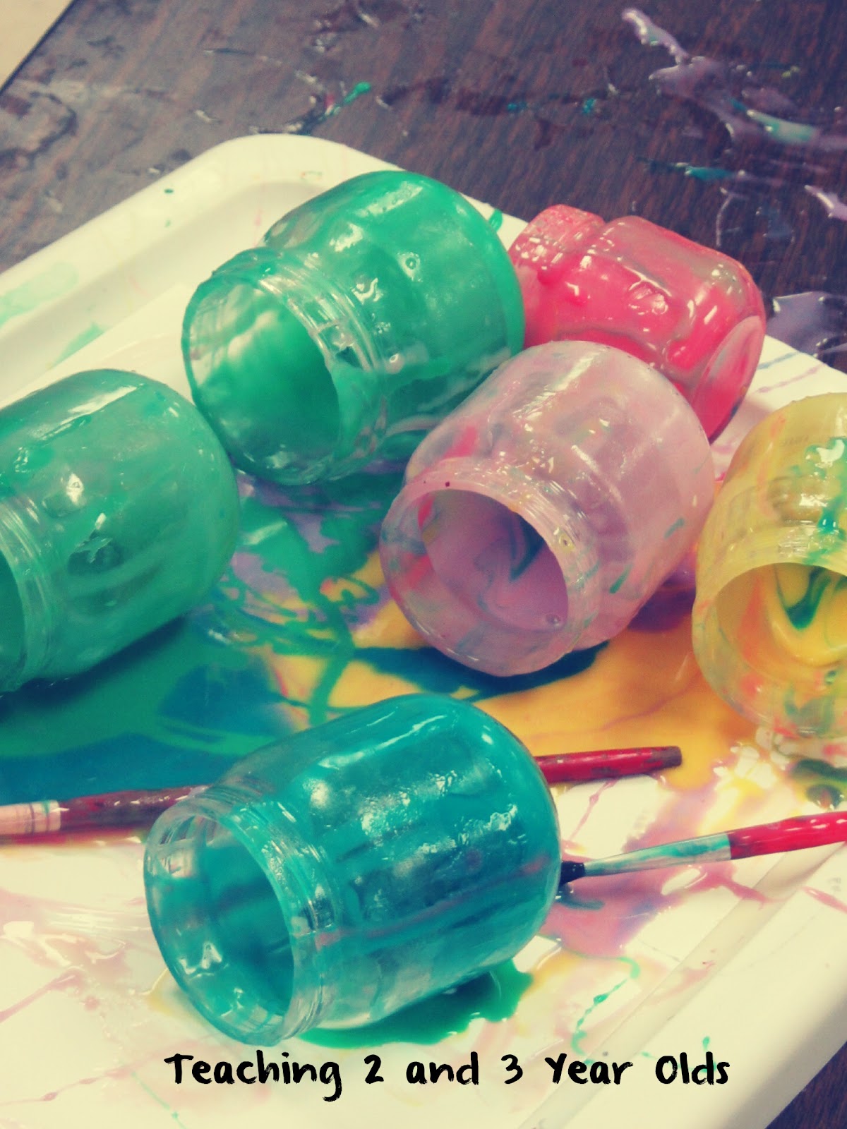 Eventually, he placed each jar ON his paper.