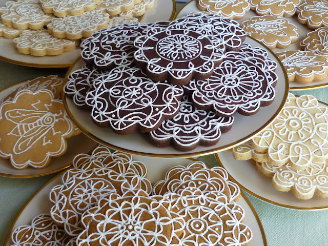 decorated dark-chocolate tea biscuits, honey-vanilla cookies, gingerbread cookies, lemon-rosemary tea biscuits