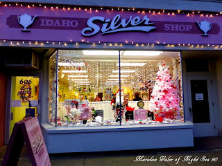 A peek at my town during Christmas; I like this window display but I'm a little concerned about the damage the infection of elves can cause. At least Santa is there to keep the elves from getting away with too much mischief before Christmas.