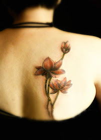 red lotus flower tattoo on the back