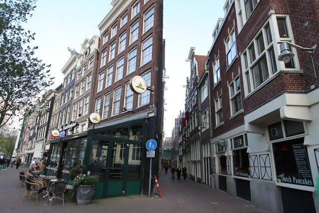 Unfortunately this isn't a collage page. These rows of buildings are built slanting towards the horizontal to accommodate limited space and streets in Amsterdam, Netherlands Unfortunately this isn't a collage page. These rows of buildings are built slanting towards the horizontal to accommodate limited space and streets in Amsterdam, Netherlands