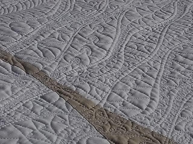 Soliloquy, quilted wall hanging by Hilary Florence art quilt, free motion quilting, curved piecing, white on white, original design