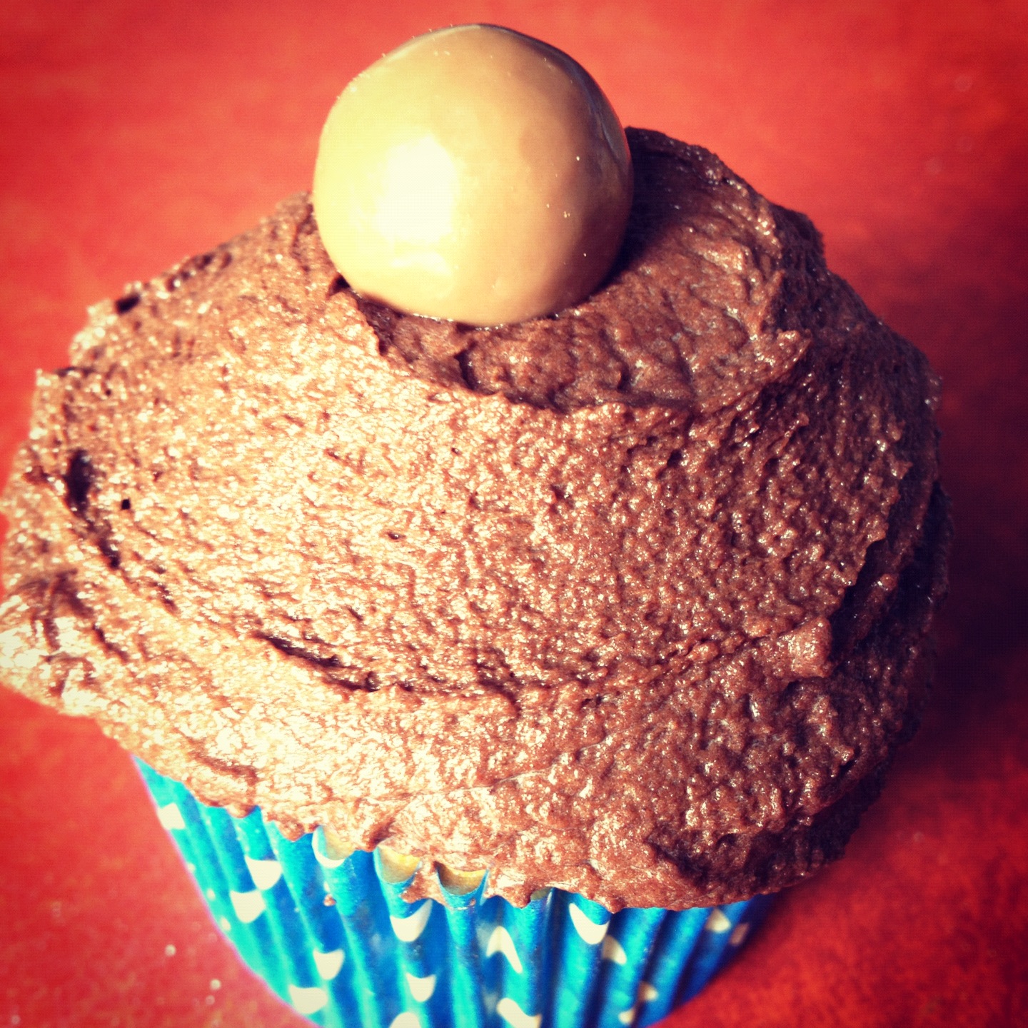 RECIPE Chocolate topped, custard filled vanilla cupcakes. Handbags