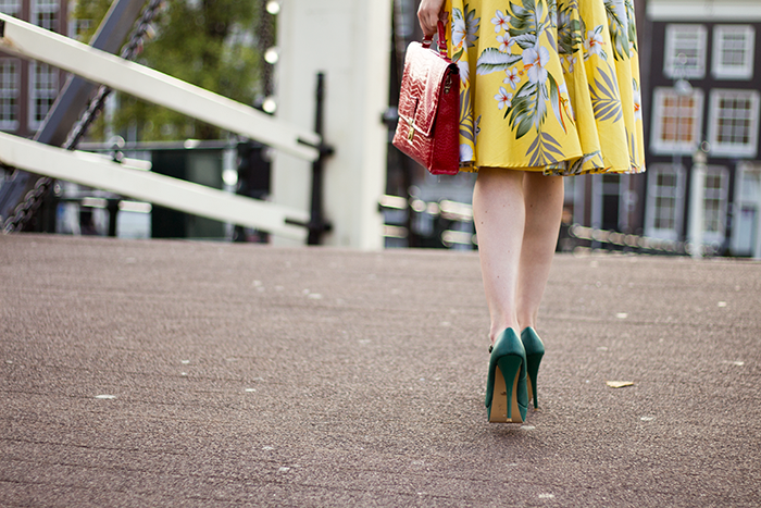 Outfit detail shot midi skirt green heels red bag