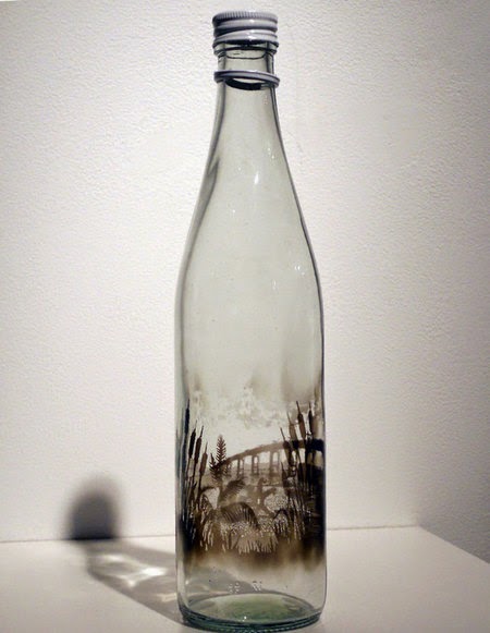 smoky glass bottle that hold the story and beauty