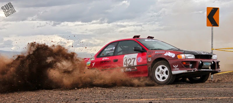 Subaru Impreza rally car throwing dirt