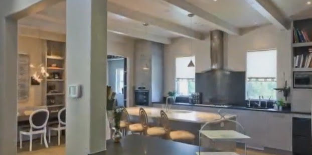 The Gourmet Kitchen Has Wood Plank Floors Steel Blue Flat Fronted The Gourmet Kitchen Has Wood Plank Floors Steel Blue Flat Fronted