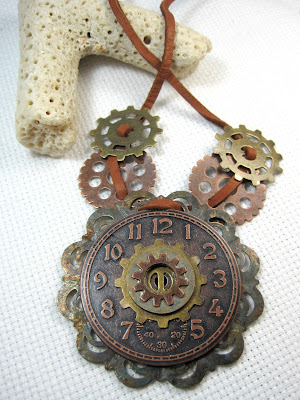 Clock face and gears necklace Steampunk style clock and gear necklace on leather